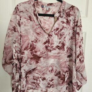 Jennifer Lopez floral blouse.